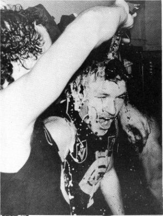 1981 GF Sheldon pours champers over Buckley.