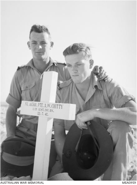 Brothers Ron and Phil Chitty visiting their brother Arthur's grave November 11 1943. Arthur Wilson Chitty younger brother of Bob played Reserves football for Carlton in 1940. Arthur was killed in action at the Battle of El Alamein Egypt July 22 1942.
Australian War Memorial image MEA0960