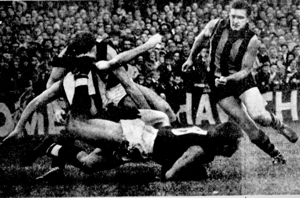 1964 Rnd 2 v Hawthorn at Glenferrie
John Benetti (8), Gordon Collis, unknown Hawthorn player, and Hawk John Peck running in.
Age April 27