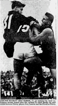 "Carlton recruit Greg Hardie, 17, got initiated the hard way. Tempers became heated after this incident in which Hardie was sandwiched between Fitzroy players Gary Lazarus and Ian Powell at Fitzroy." (Age photo.)